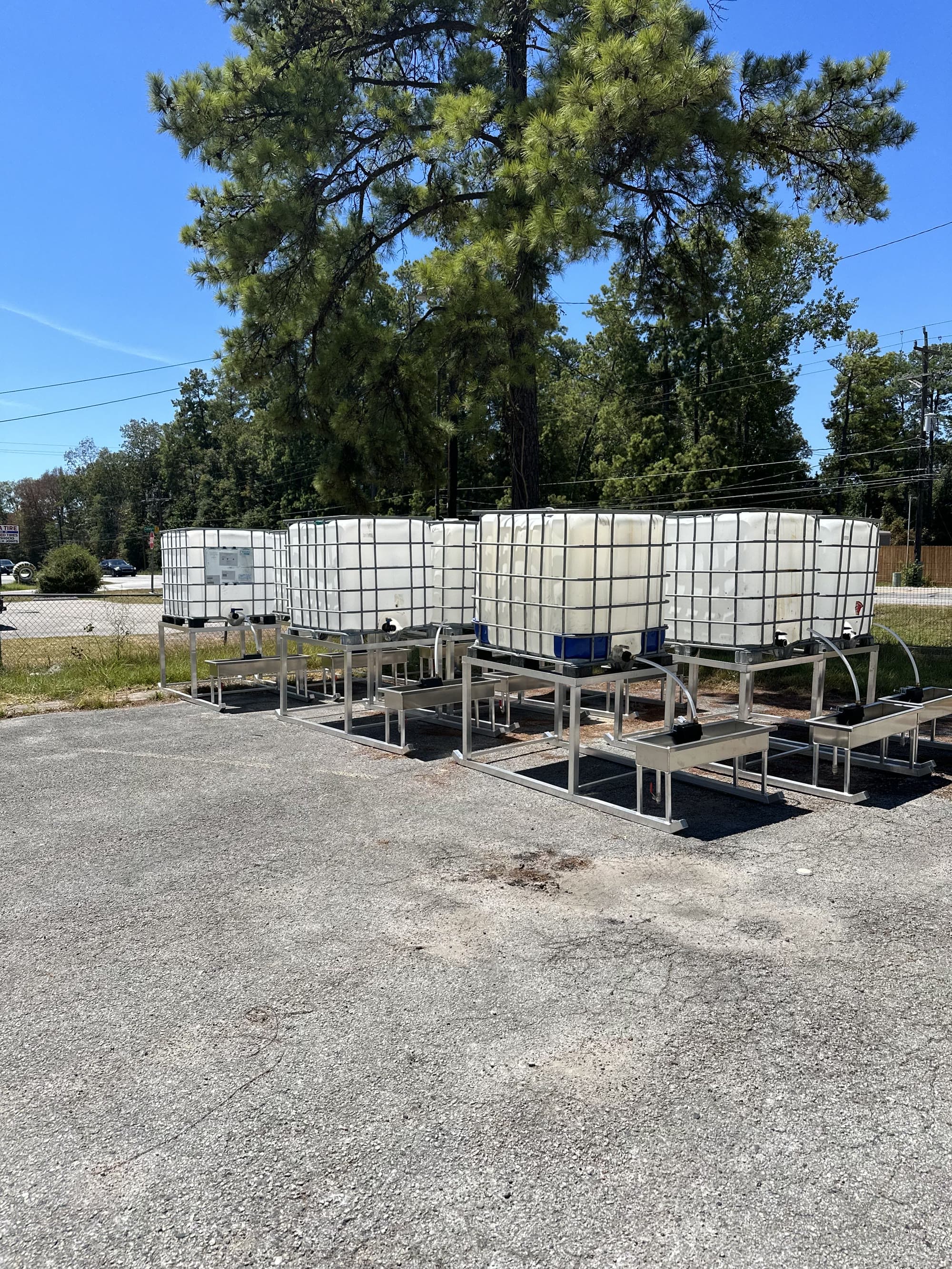 A group of aluminum water troughs.